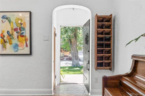 a view of front door with wooden floor