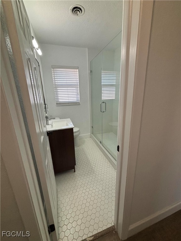 5521 Granada Road Fort Myers, FL 33919 - Photo 11 of 17 a bathroom with a granite countertop shower a sink and a mirror