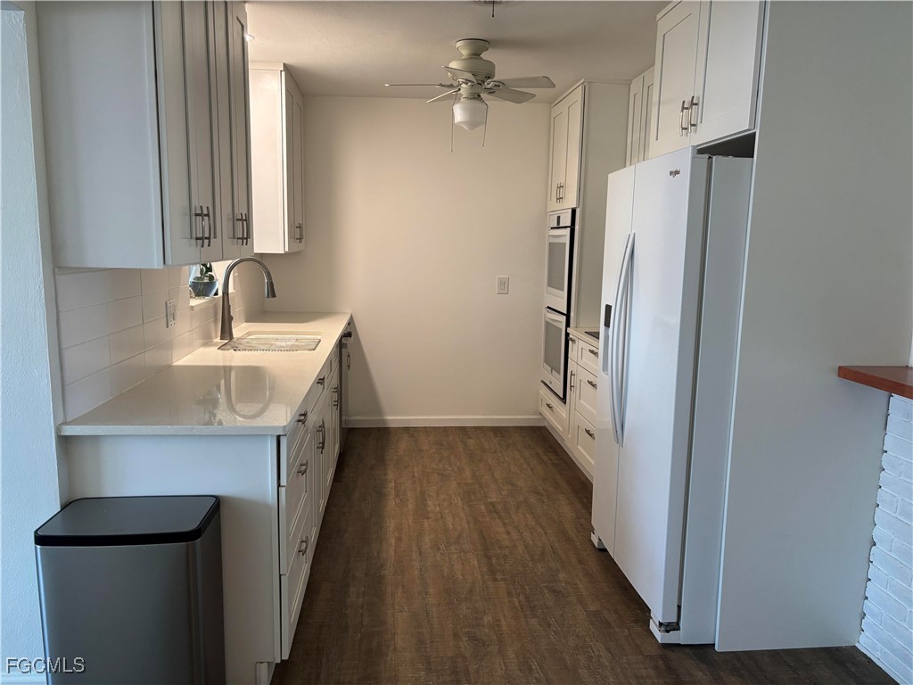 5521 Granada Road Fort Myers, FL 33919 - Photo 6 of 17 a bathroom with a sink a toilet a mirror and shower