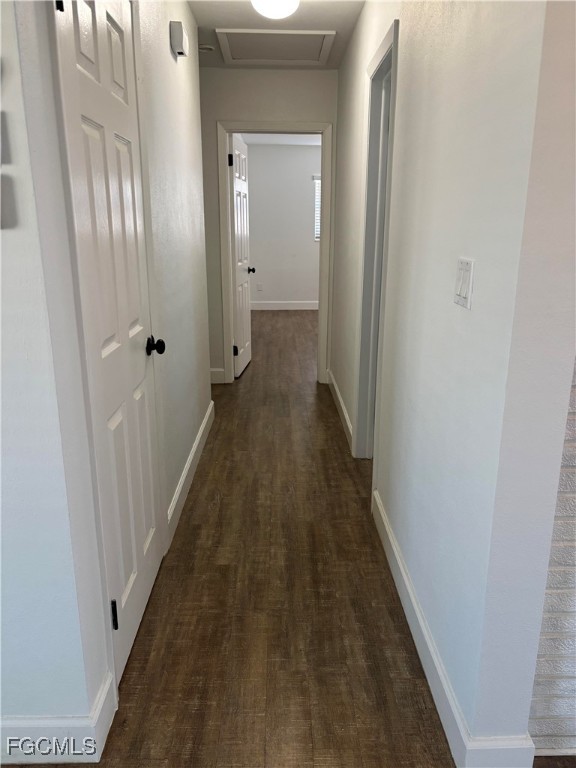 5521 Granada Road Fort Myers, FL 33919 - Photo 9 of 17 a view of a hallway with a wooden floor
