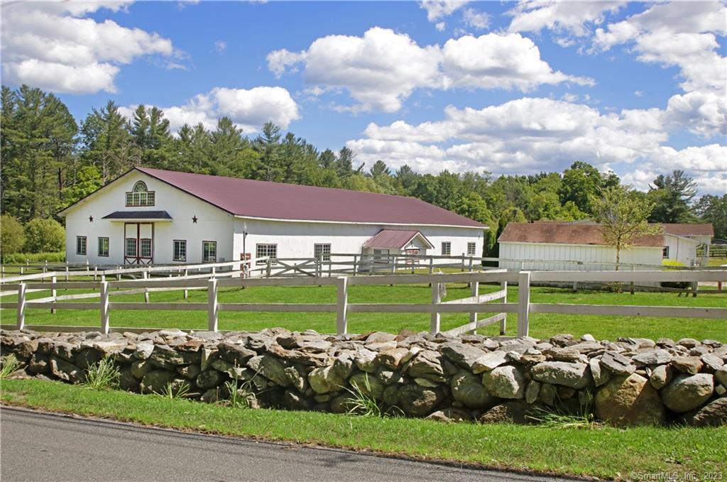 a front view of a house with a big yard