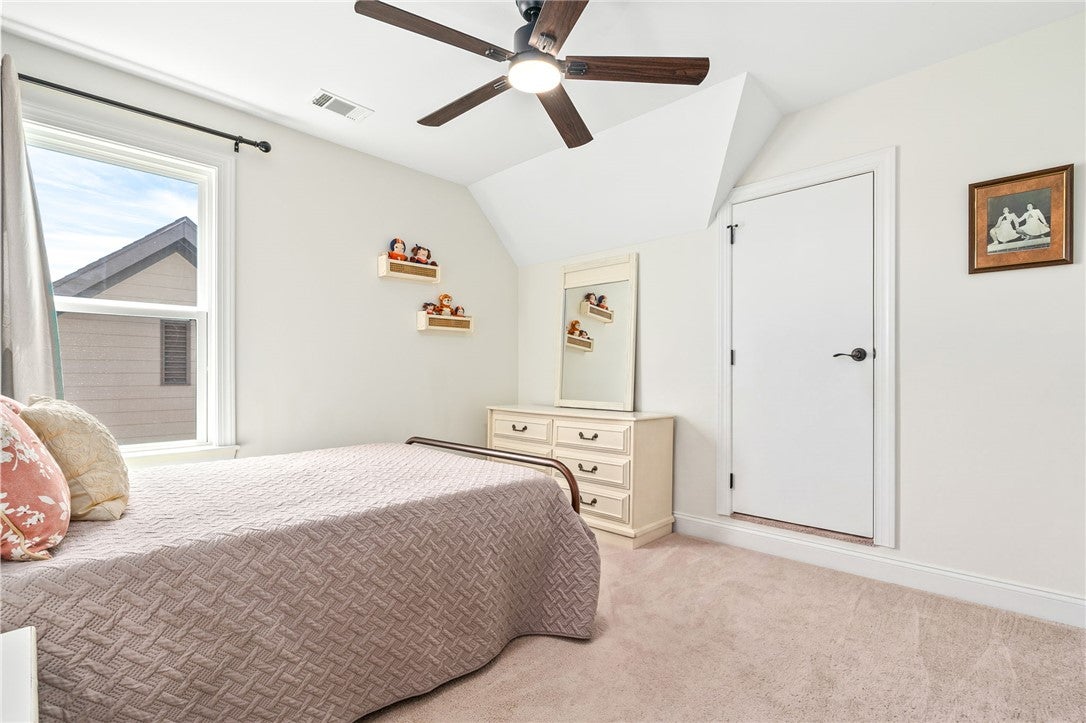 2324 Rutland Road Auburn, AL 36832 - Photo 14 of 22 This bright and inviting bedroom offers comfort and a tranquil atmosphere.