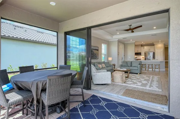 a dining room with furniture and wooden floor