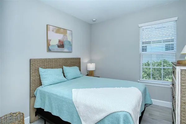 a bedroom with a bed and a cabinets