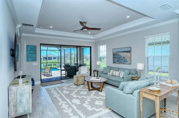 a living room with furniture and a large window