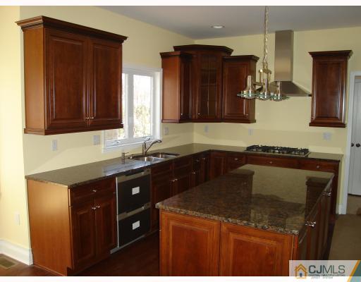 12 Frances Road Edison, NJ 08820 - Photo 5 of 10 a kitchen with a sink and cabinets