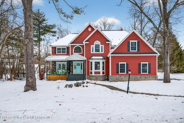 a view of entryway with wooden floor and stairs