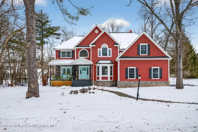 a view of entryway with wooden floor and stairs