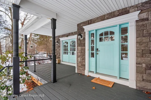 a kitchen with stainless steel appliances kitchen island granite countertop a table chairs and a refrigerator