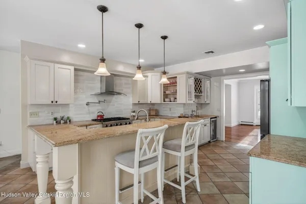 a living room with furniture fireplace and a flat screen tv