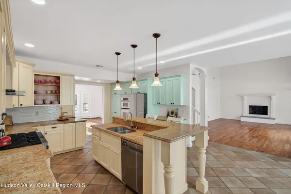 a view of a hallway with wooden floor and entryway