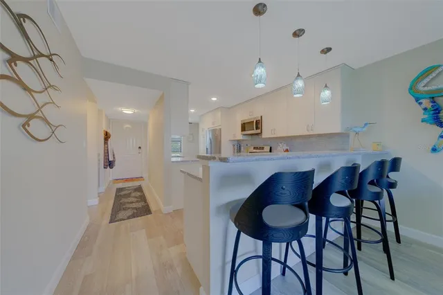 a view of a hallway with a chandelier