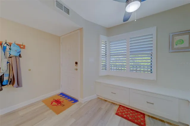 a large kitchen with a sink and cabinets
