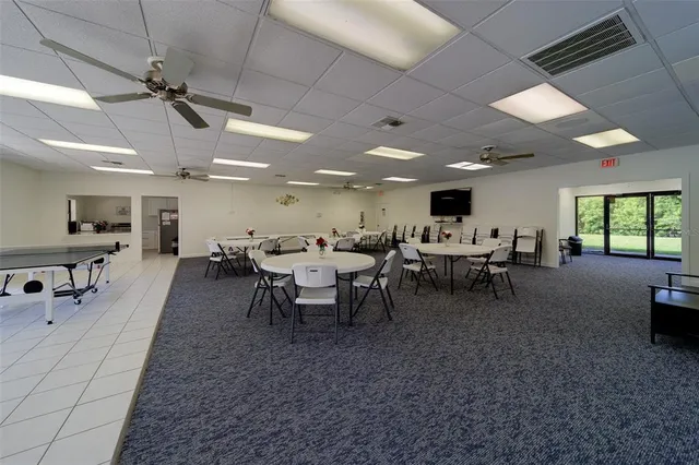 an aerial view of a house with a garden and lake view