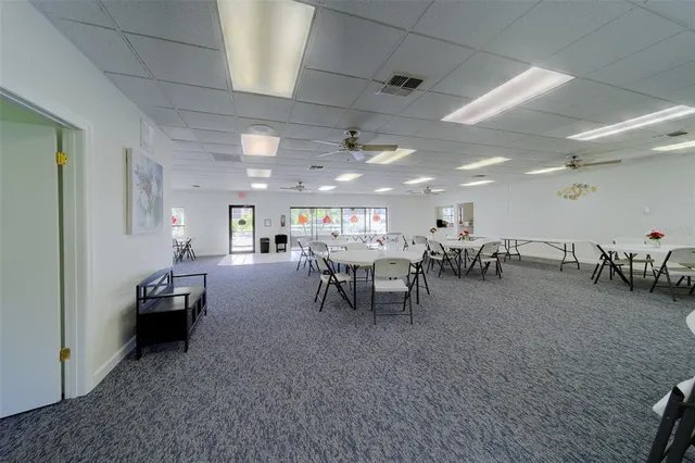 an aerial view of house with yard swimming pool and outdoor seating