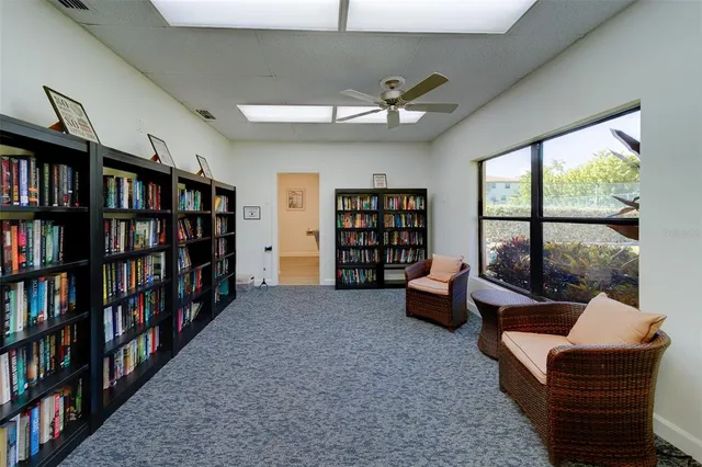 an aerial view of a house with a swimming pool yard and outdoor seating