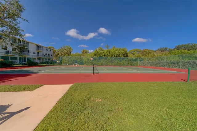 an aerial view of residential building and lake
