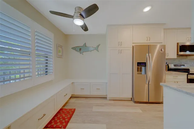 a kitchen with granite countertop a stove and a sink
