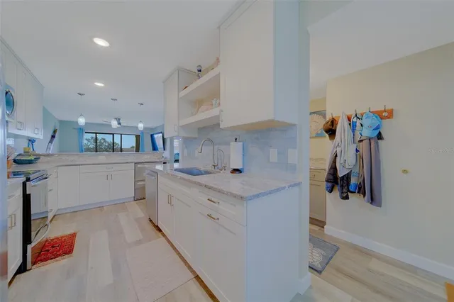 a view of a storage and utility room with washer and dryer
