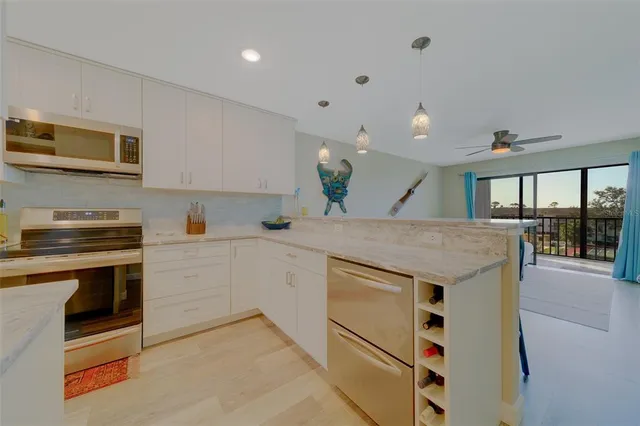 a view of kitchen and dining area with furniture