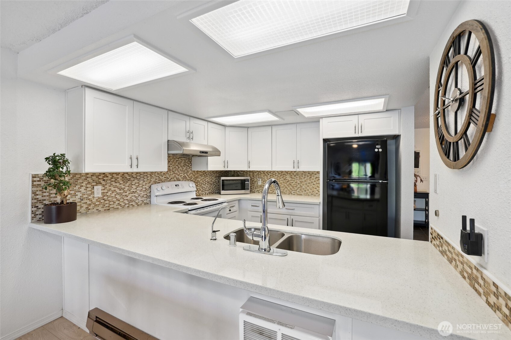 30831 13th Place South, Unit 13 Federal Way, WA 98003 - Photo 13 of 38 a kitchen with stainless steel appliances granite countertop a sink and a stove