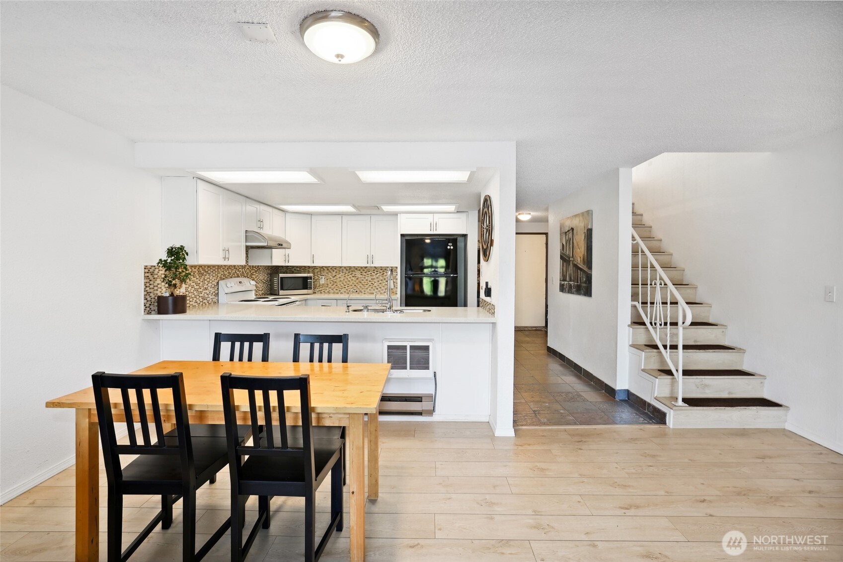 30831 13th Place South, Unit 13 Federal Way, WA 98003 - Photo 15 of 38 a view of kitchen and dining room with wooden floor