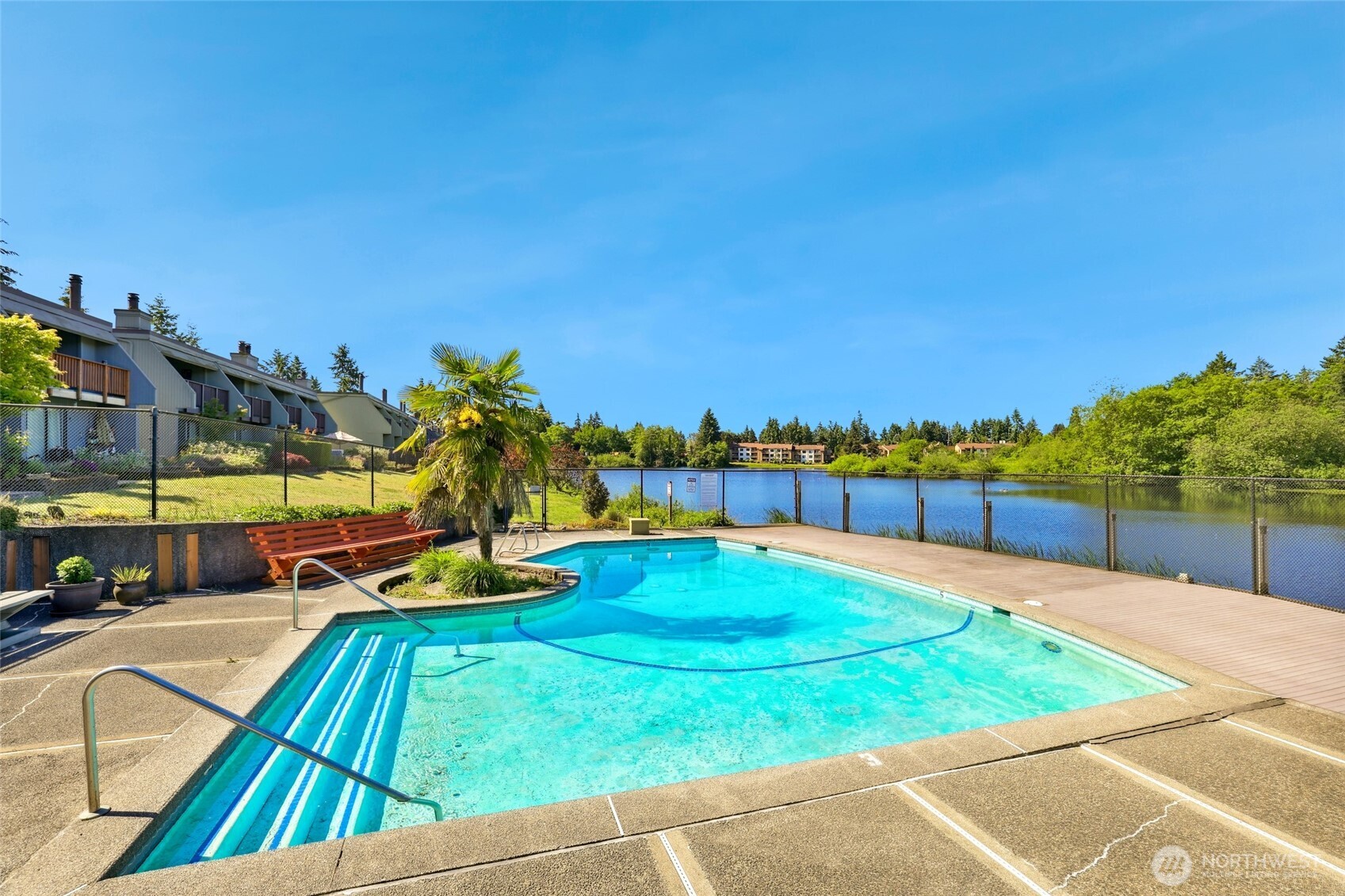 30831 13th Place South, Unit 13 Federal Way, WA 98003 - Photo 30 of 38 a view of a swimming pool with an outdoor seating and a yard