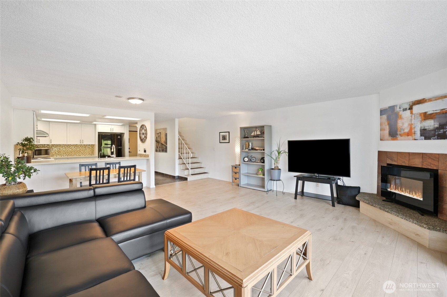 30831 13th Place South, Unit 13 Federal Way, WA 98003 - Photo 5 of 38 a living room with furniture and a flat screen tv