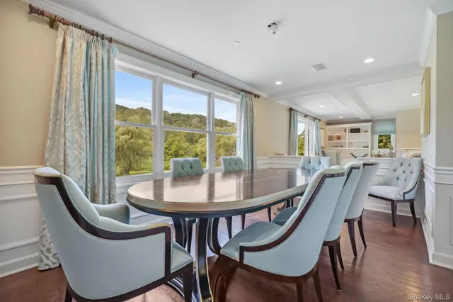a dining room with furniture and window