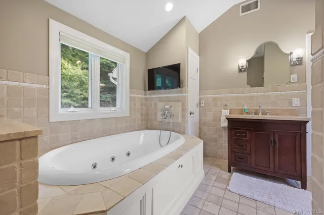 a bathroom with a bathtub and a sink