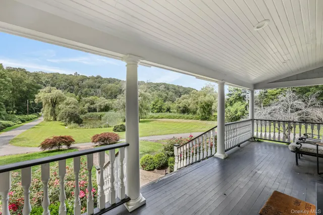 a view of a balcony with wooden floor