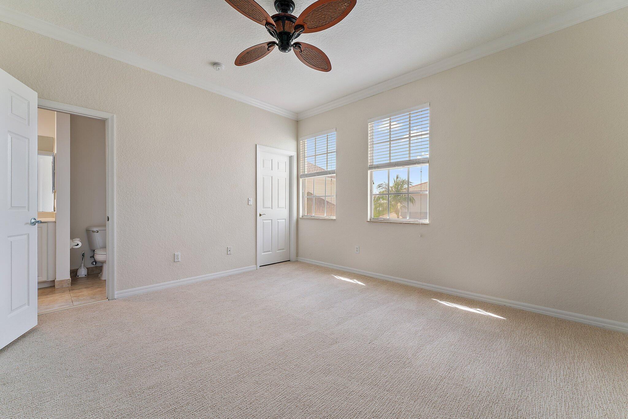 128 West Thatch Palm Circle Jupiter, FL 33458 - Photo 18 of 31 a view of an empty room with a window
