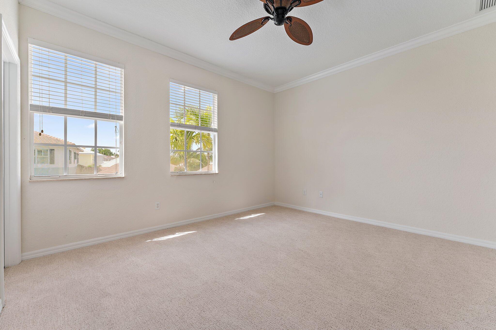 128 West Thatch Palm Circle Jupiter, FL 33458 - Photo 20 of 31 a view of an empty room with a window