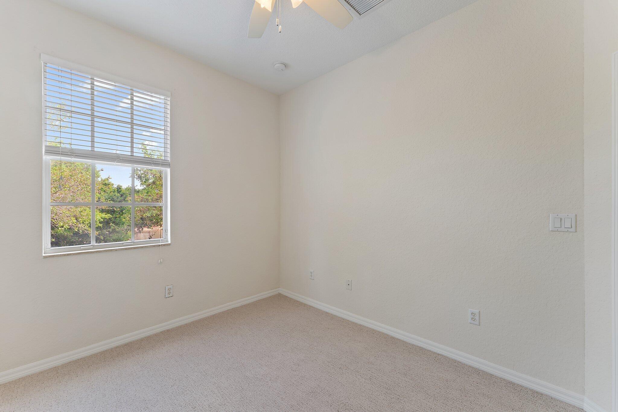 128 West Thatch Palm Circle Jupiter, FL 33458 - Photo 24 of 31 an empty room with a window