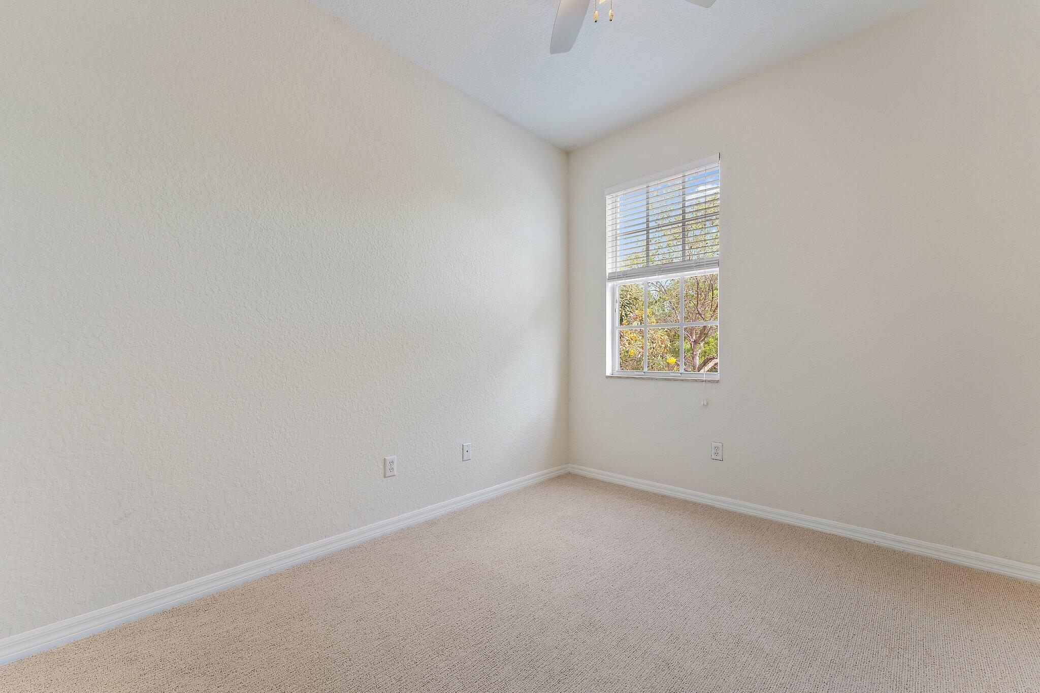 128 West Thatch Palm Circle Jupiter, FL 33458 - Photo 26 of 31 an empty room with windows