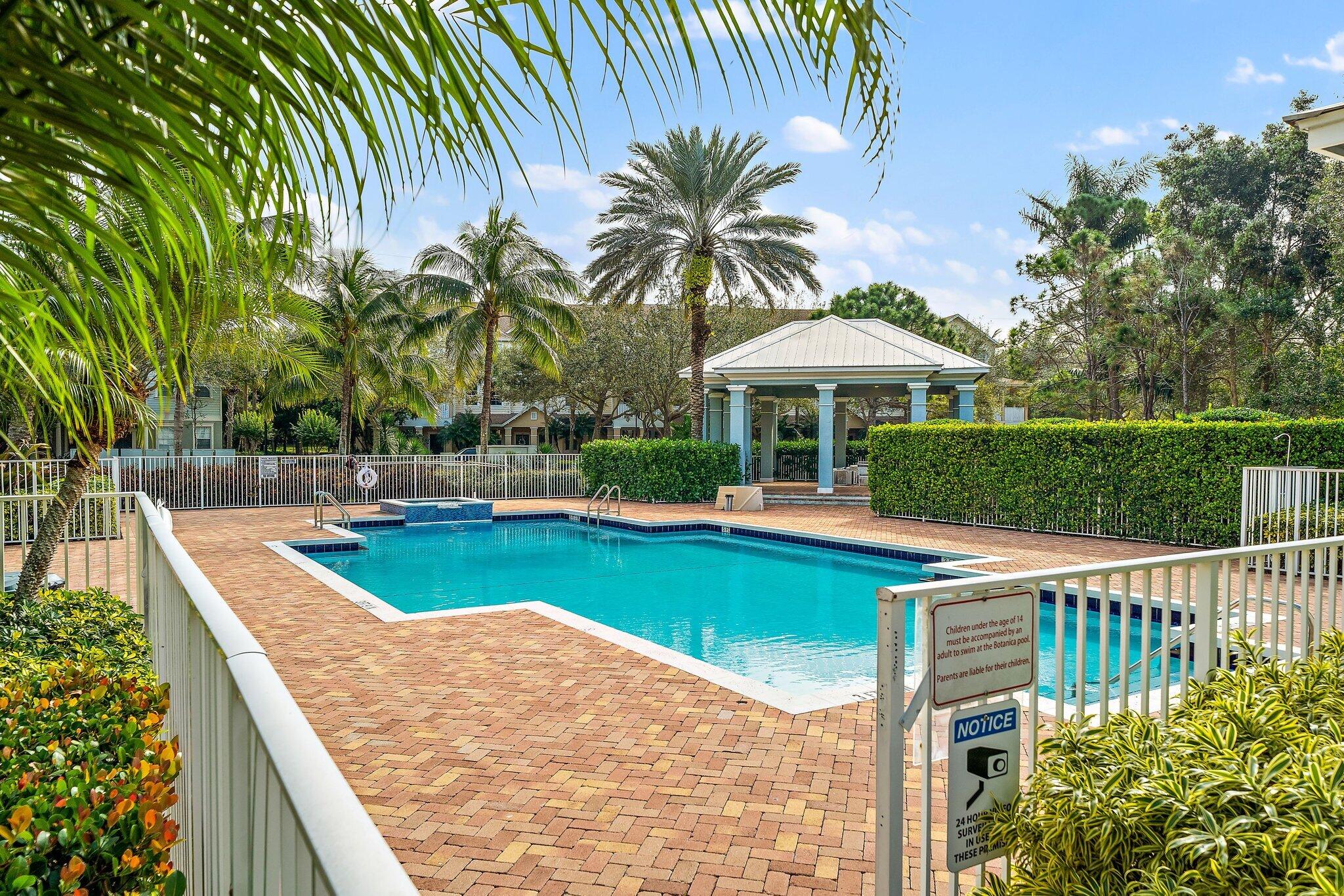 128 West Thatch Palm Circle Jupiter, FL 33458 - Photo 29 of 31 a view of a swimming pool with a patio