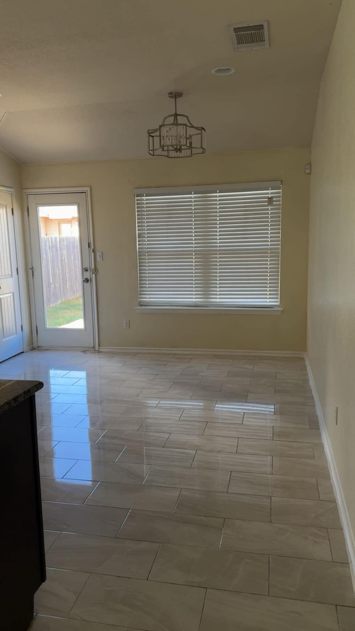 13004 Tinker Street Manor, TX 78653 - Photo 6 of 9 The breakfast area features polished tile flooring and a bright window overlooking the yard.