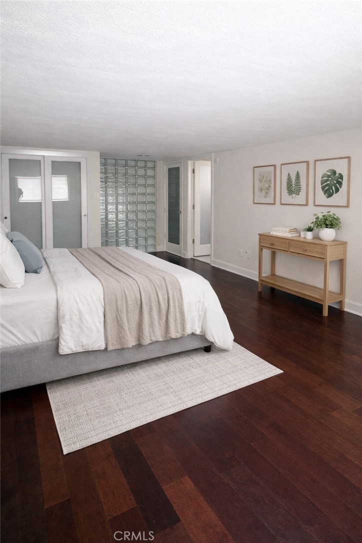 600 Ridgeley Drive Los Angeles, CA 90036 - Photo 18 of 29 a bedroom with a bed and a night stand