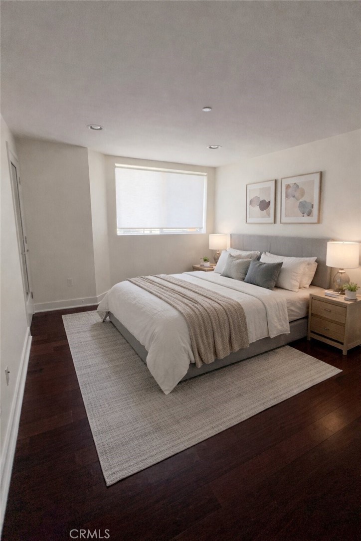 600 Ridgeley Drive Los Angeles, CA 90036 - Photo 20 of 29 a bedroom with a bed and a night stand
