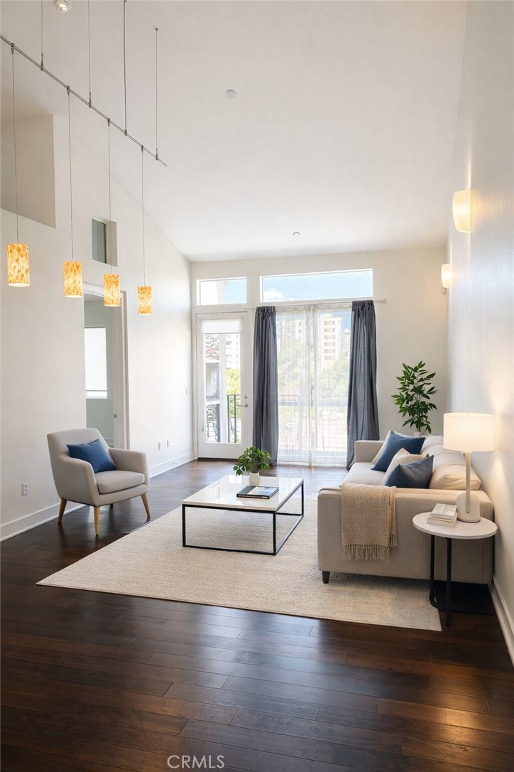 600 Ridgeley Drive Los Angeles, CA 90036 - Photo 2 of 29 a living room with furniture and a large window