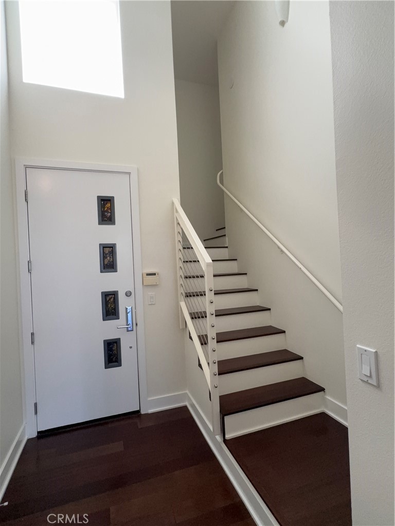 600 Ridgeley Drive Los Angeles, CA 90036 - Photo 24 of 29 a view of entryway with wooden floor and stairs