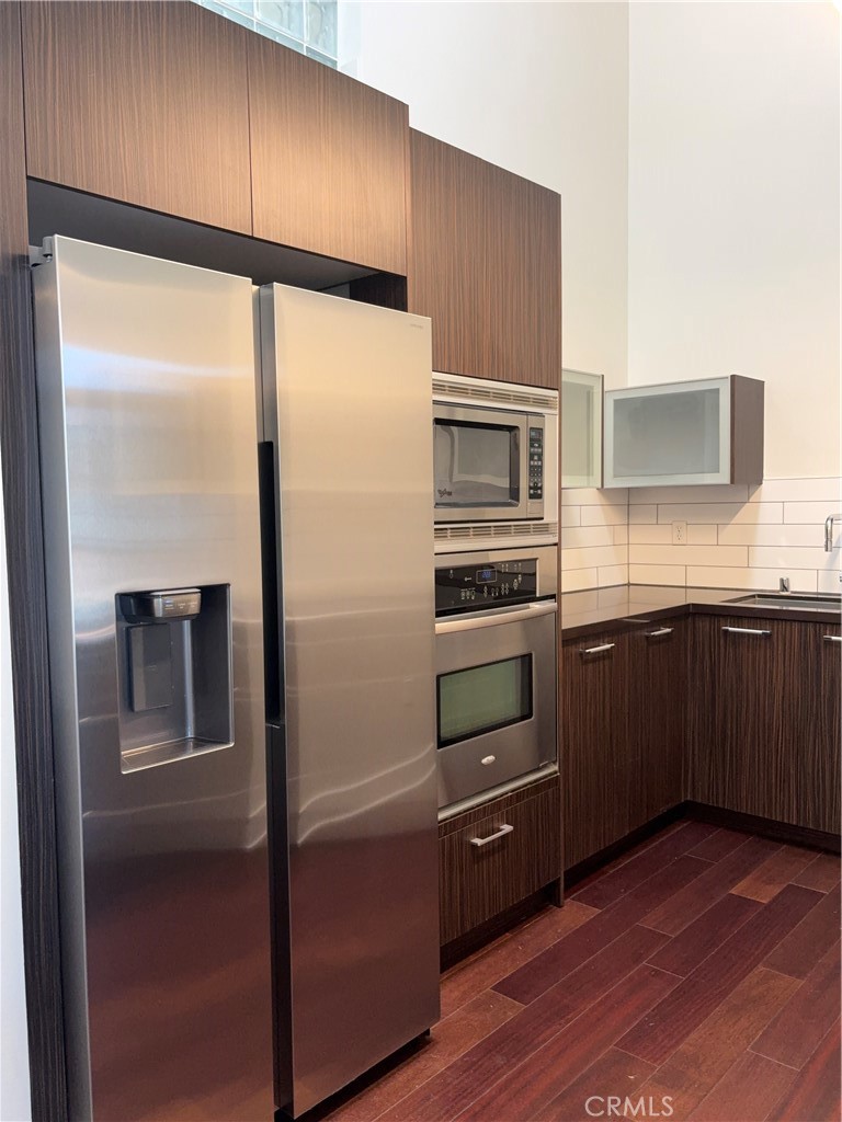 600 Ridgeley Drive Los Angeles, CA 90036 - Photo 7 of 29 a kitchen with a refrigerator and a sink