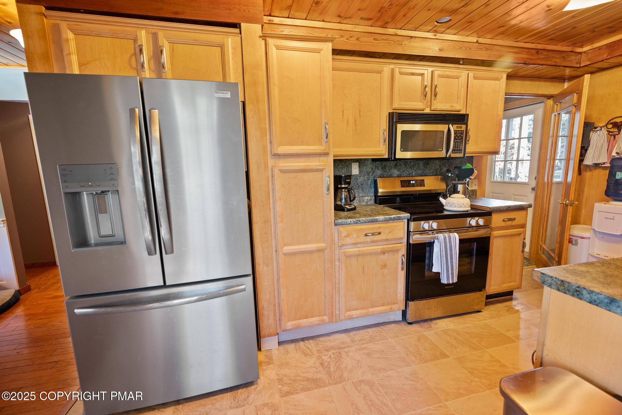 165 Sweet Briar Road Pocono Pines, PA 18350 - Photo 12 of 39 a kitchen with stainless steel appliances a refrigerator sink and microwave
