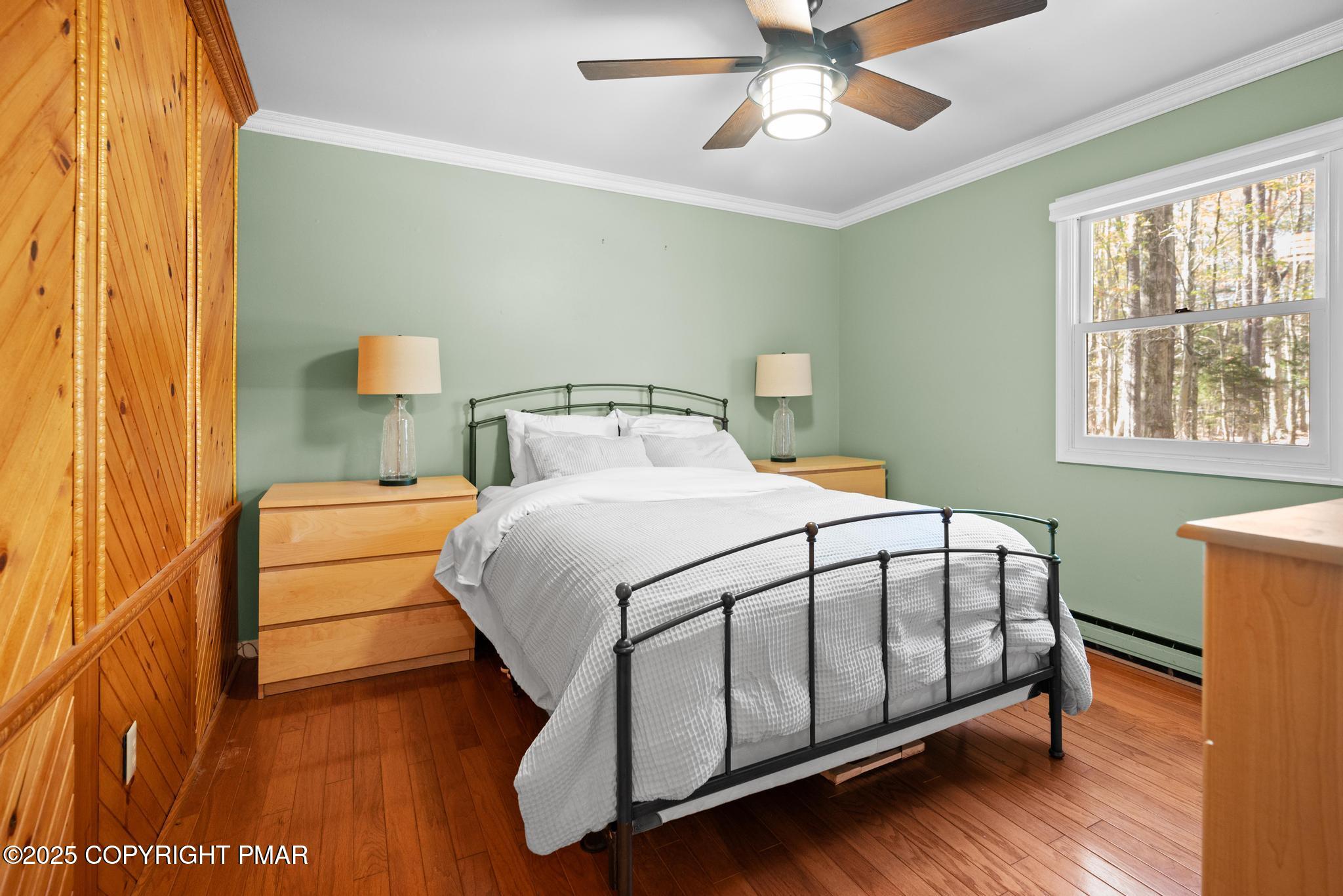 165 Sweet Briar Road Pocono Pines, PA 18350 - Photo 15 of 39 a bedroom with a bed and a window