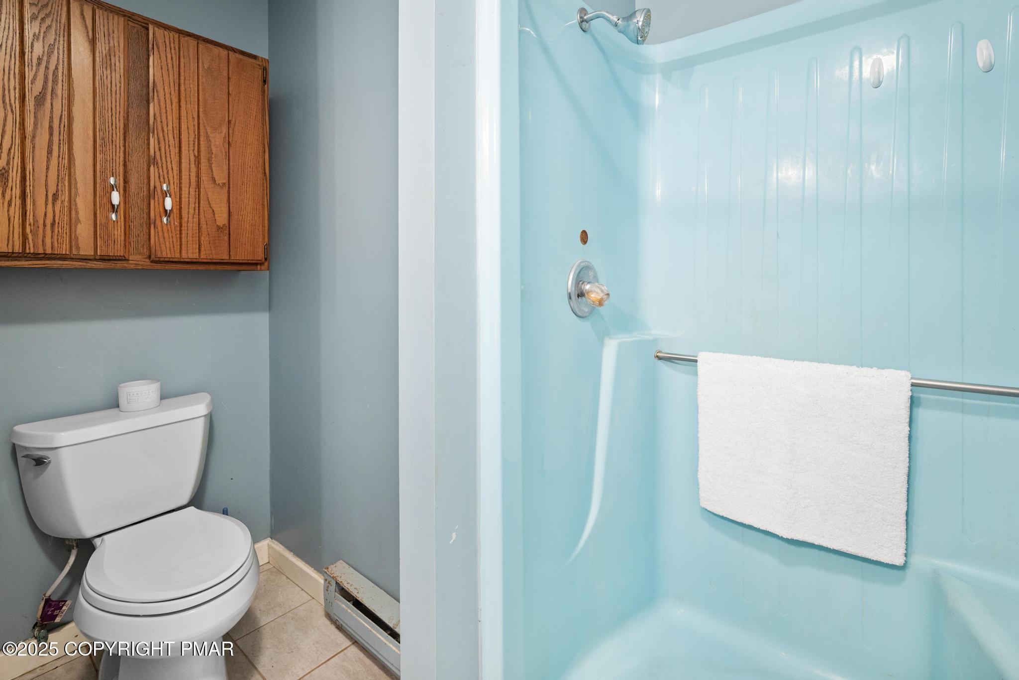 165 Sweet Briar Road Pocono Pines, PA 18350 - Photo 18 of 39 a white toilet sitting next to a bathroom
