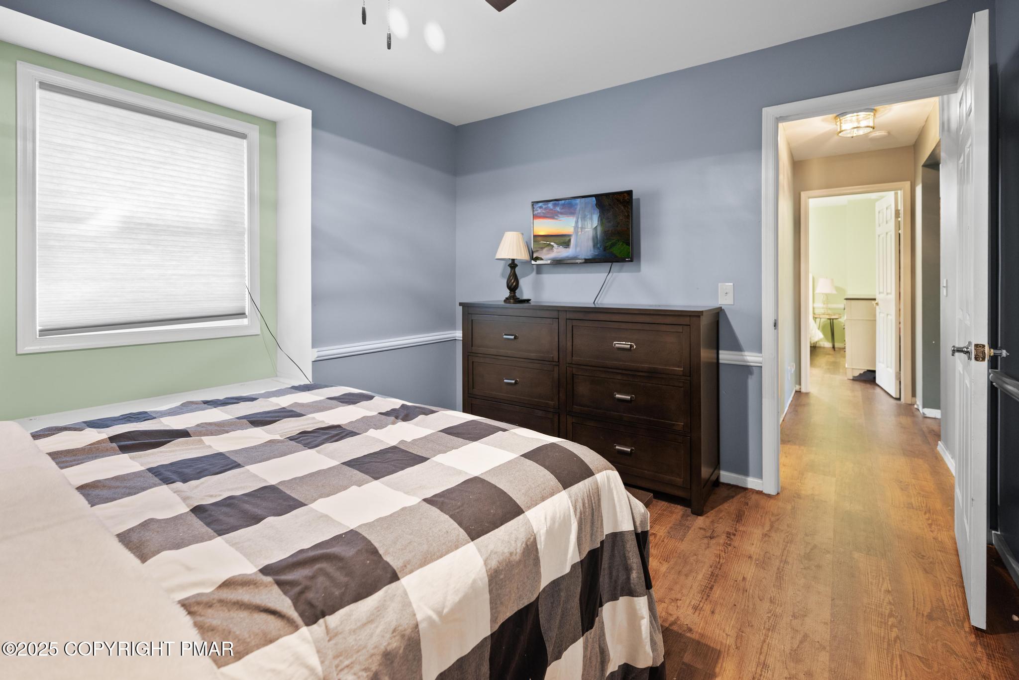 165 Sweet Briar Road Pocono Pines, PA 18350 - Photo 29 of 39 a bedroom with a bed and a dresser