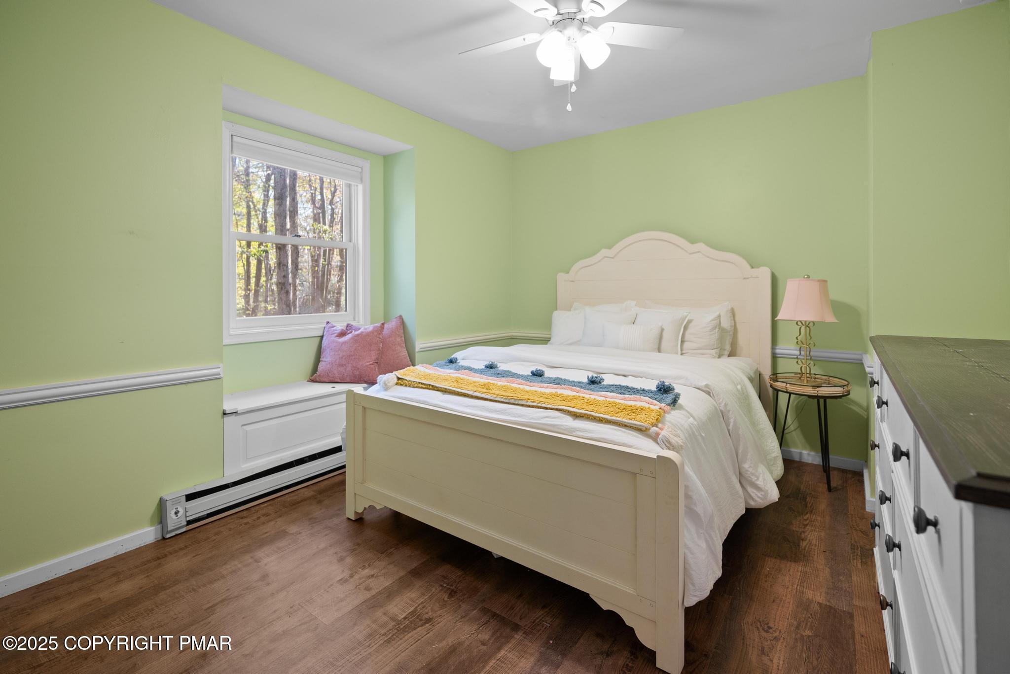 165 Sweet Briar Road Pocono Pines, PA 18350 - Photo 30 of 39 a bed room with a bed and a chandelier