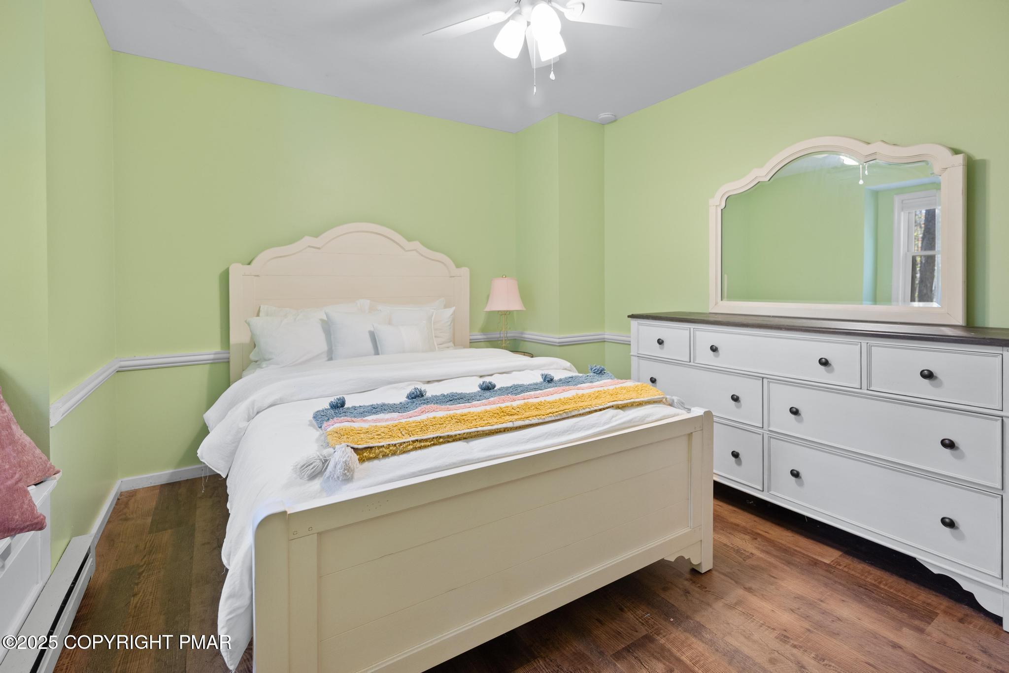 165 Sweet Briar Road Pocono Pines, PA 18350 - Photo 31 of 39 a bedroom with a bed and a mirror