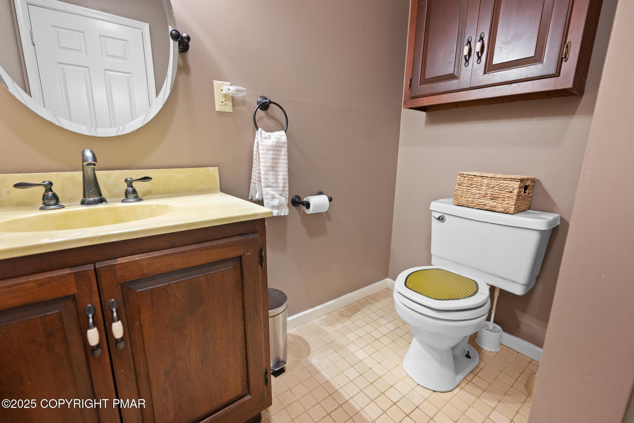 165 Sweet Briar Road Pocono Pines, PA 18350 - Photo 32 of 39 a bathroom with a sink a toilet and a mirror