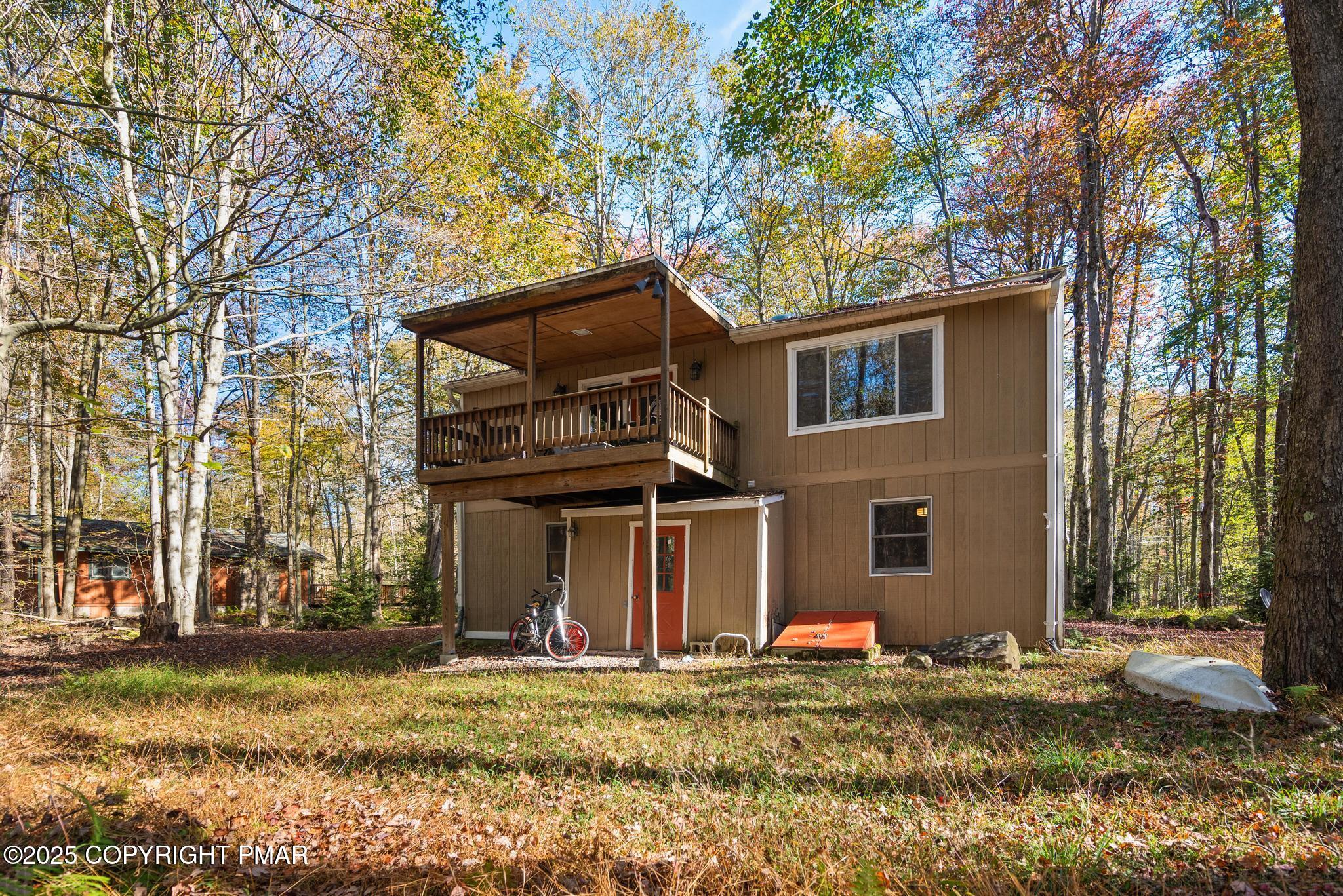 165 Sweet Briar Road Pocono Pines, PA 18350 - Photo 35 of 39 a view of a house with a yard and large tree